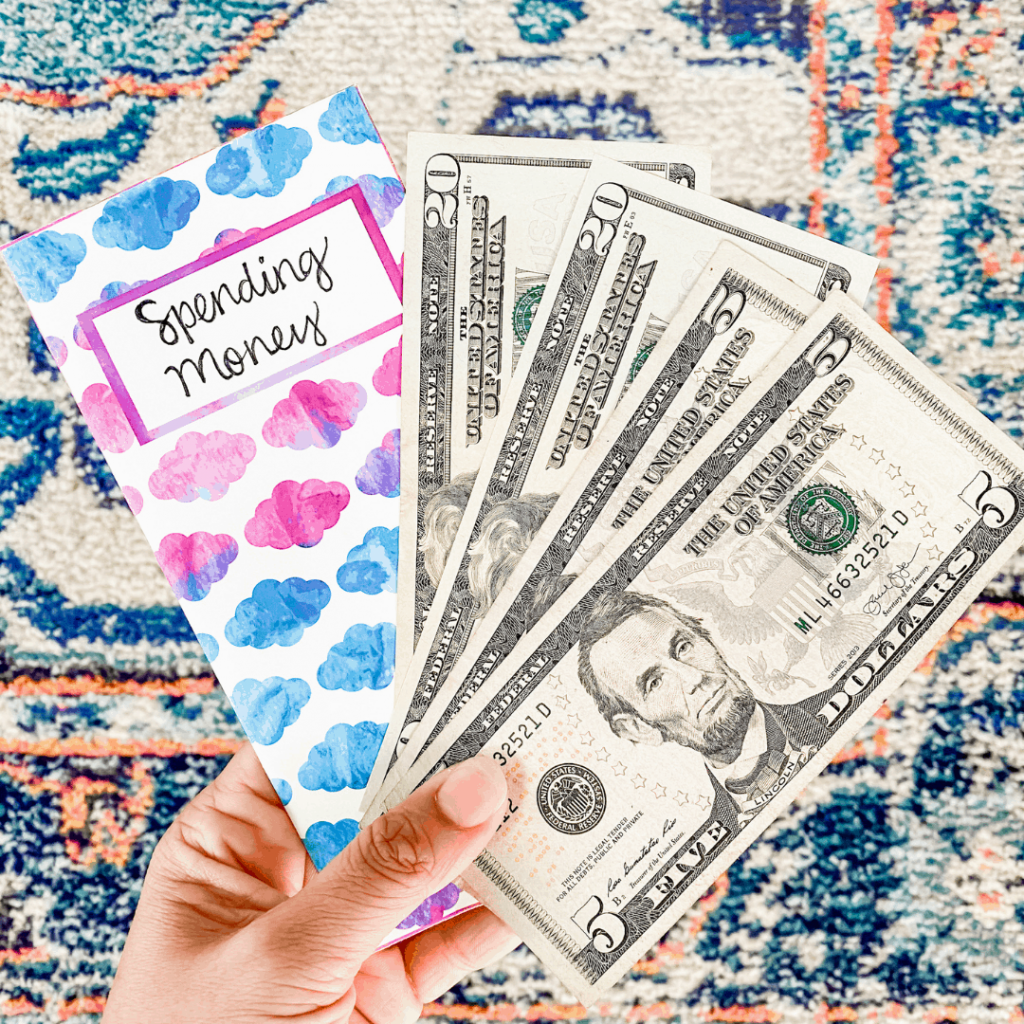 Cash and a colorful patterned envelope with a label