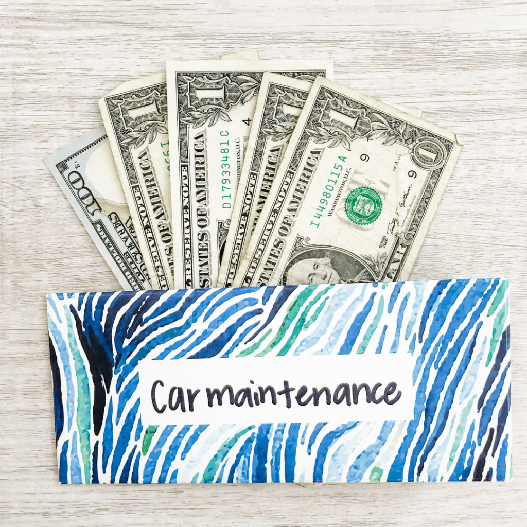 Cash inside a colorful patterned envelope with a label