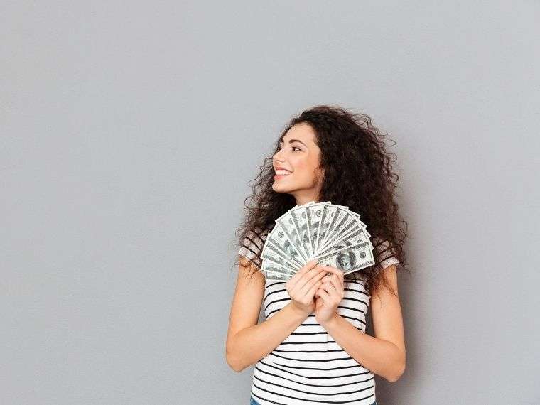 woman holding money