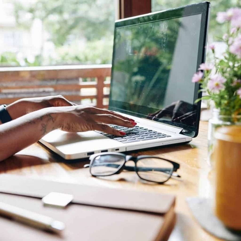 woman typing on computer