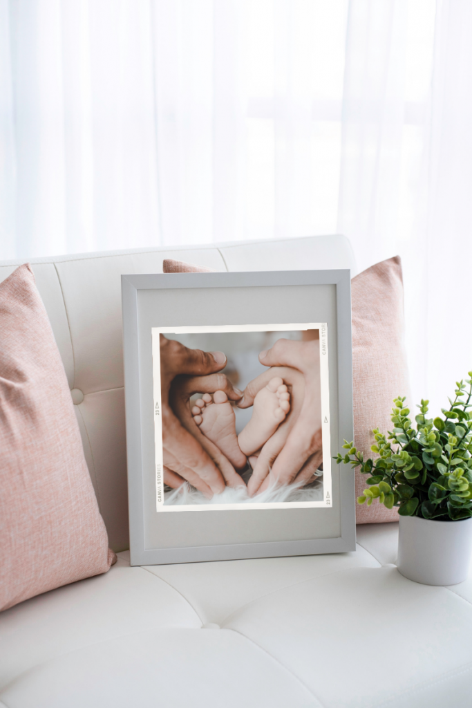 A photo of a baby's feet cradled in a mother and father's hands 