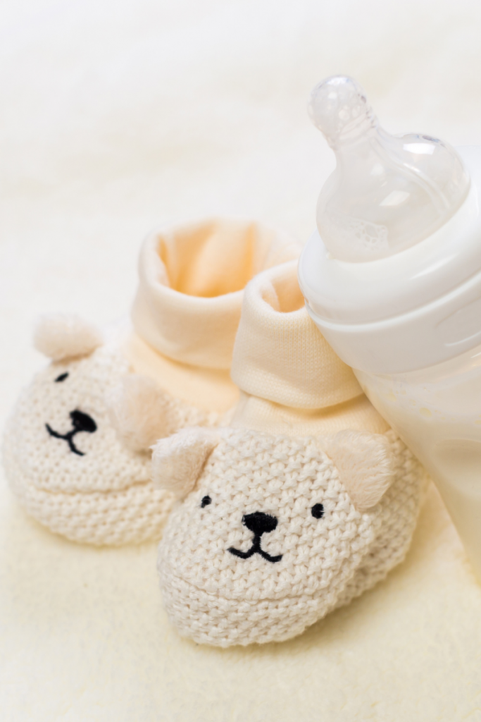 Baby shoes and bottle